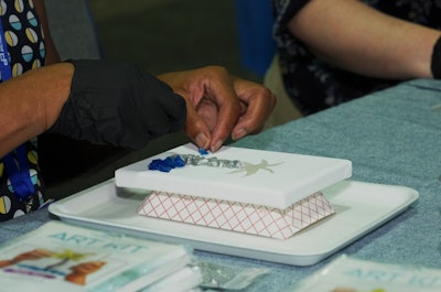 Visit South Walton took to DIY resin art to capture attendees' attention on the trade show floor.