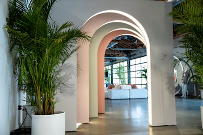 Los Angeles-based Stoelt Productions designed and produced the event, using a four-color palette of white-gray, dusty rose, green eucalyptus and terracotta. Curved lines and illuminated arches added a cohesive design element throughout the space. Taylor Creative served as the decor vendor.