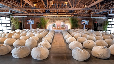 The panel discussion area used bean bag chairs as seating. “Logistically, finding 100 bean bags in the middle of COVID was hilarious—it was the one thing that kept me up at night about this job!” laughed Stoelt. Getting the exact right level of comfort was important, he said: It had to be soft, but he also didn’t want attendees zoning out during the panels.