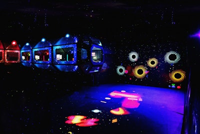 Guests enter Cosmic CAMP through a launch pad area that activates fog, mimicking a spaceship that's about to take off.