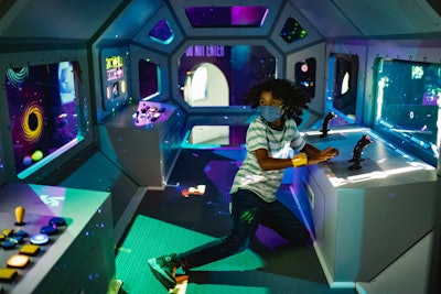 A space shuttle area acts as a transport center into the entire exhibit and is completely interactive.