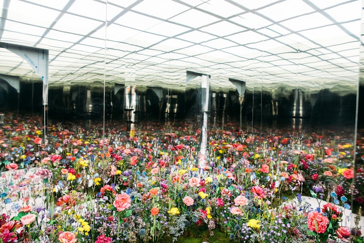 Floral designer Lewis Miller helped create an infinity flower field mirror room inside the space.