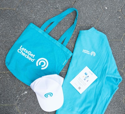 Visitors received branded giveaway items like hats and tote bags.