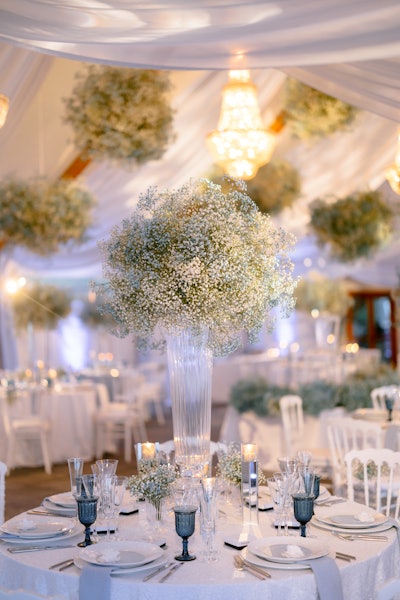 Pops of blue brought the all-white table settings to life.