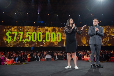 Benefit host Cecily Strong was joined on stage by her Saturday Night Live costar Bowen Yang to announce the final amount of money raised throughout the evening.