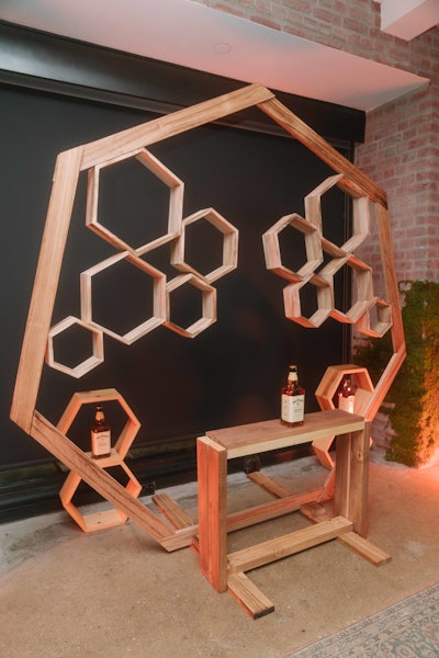 A beehive-inspired art installation by artist Lori Tannis served as the focal point.
