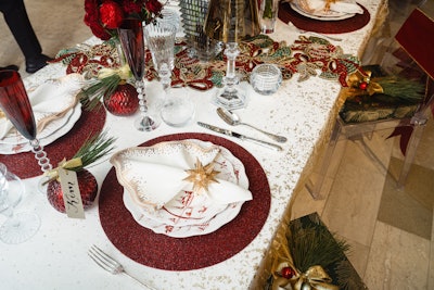 Kim Seybert's vignette features a white and red color palette with twinkling gold accents.