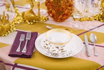 Drake/Anderson’s tablescape features glittery African animals resting under a sparkly tree.