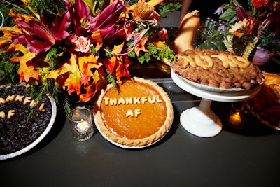 Adding to the event's Friendsgiving theme was a central cafe where guests could sip a specialty cocktail, mingle and sample pies topped with cheeky sayings like 'Thankful AF' and 'XOXO.' The menu also featured roast turkey, ruffled mashed potato, classic mac 'n' cheese, beef short rib Wellington, root vegetable succotash tart and Brussels sprout pie. The pop-up's festive specialty cocktail was an Autumn Mule with vodka, ginger beer, rosemary, mint, basil, lemon and pomegranate seeds.