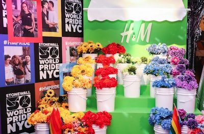 Also tying into the bodega theme was an installation inspired by a flower shop, with buckets of flowers in colors of the rainbow.