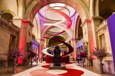 Even though it's famously held in May, the iconic Met Gala typically offers a wealth of floral inspiration—and in 2016, the event’s staggering 1 million flowers had a Valentine’s Day-appropriate red and pink theme. The gala celebrated “Manus x Machina: Fashion in an Age of Technology,” and guests were greeted by a hand-stenciled hot-pink-and-red carpet, along with a 65-foot-tall double-helix structure fashioned from 400 yards of floral-print white lace placed on aluminum panels. The second helix comprised 200,000 roses, which were artificial to keep the helix under 1,500 pounds so it could be rigged entirely from the ceiling. Fresh red roses and cherry blossoms lined the room.