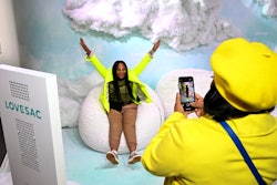 Attendees posed for photos in the cloud-like setting.