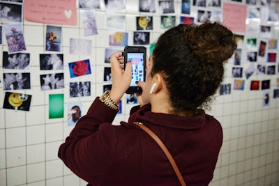 For Valentine’s Day in 2018, photographer Ruvan Wijesooriya partnered with art curation website Absolut Art to turn an underground subway tunnel in New York into a public art installation. The tunnel showcased thousands of Wijesooriya’s photographs of people kissing, as well as photos of bunnies, rainbows, flowers and puppies. Passersby were invited to select one photo from the installation to take with them.