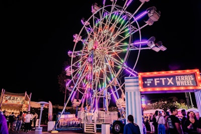 The event also included an 80-foot slide and a custom Ferris wheel from FTX, which included a QR code for guests to scan from the ride’s cabins. Other fun sponsor activations included a human claw machine from Maker’s Mark, a custom speakeasy from Pepsi, bars from Bud Light Seltzer and New York-style pizza from Papa Johns. There were also bumper cars and oversize arcade games, plus performances by Zedd, Lil Wayne, Diplo and DJ Diesel (Shaq himself).