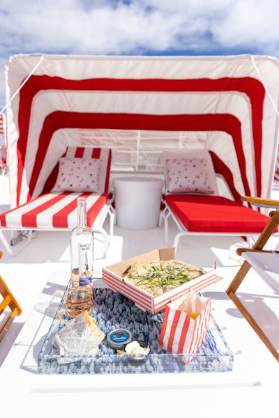 All reservations come with food and beverage selections courtesy of The Little Nell. Guests will receive Champagne or rosé and Ramona Amarino, a canned sparkling cocktail, plus caviar and accoutrements, black truffle pizza and more.