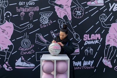 Artist Sophia Chang designed limited-edition custom merchandise, including live-designed basketballs.