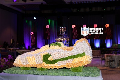 The NFL event also featured floral footballs and cleats created by Empty Vase.