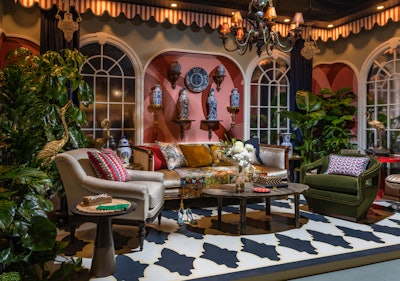 In celebration of Benjamin Moore's Color Trends 2022, the brand joined forces with designer Corey Damen Jenkins to create a fashionable conservatory for its installation. Antique and modern furnishings were juxtaposed against a painted floor motif, while lush trees and plants provided a fresh layer.