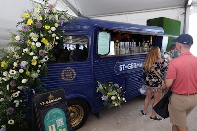 In another flower-filled activation, St-Germain Spritz cocktails were served from a vintage bus covered in florals in the Grand Tasting Tents.