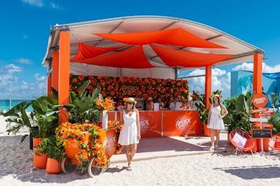 Aperol Spritz was back with its orange-hued bar outfitted with spandex drapery, a lounge area and a branded cart overflowing with complementary florals.