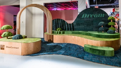 Designers from HOK and Shaw Contract reinterpreted classic landscape elements into this whimsical environment that was crafted from Shaw Contract carpet tile and natural plywood. A path punctuated by an arched wooden trellis drew visitors into the vignette entitled “Dream.” Multilevel, carpet-clad, curvilinear forms were dotted with topiary trees.