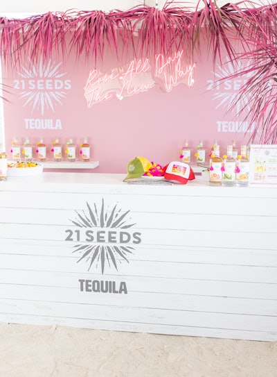 21 Seeds Tequila’s booth at the Grand Tasting featured neon-pink “Rose All Day The New Way” signage, along with a pink-hued bar backdrop and a festive hot-pink foliage border. Rose Gold Collective handled planning and design.