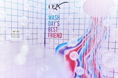 One of the activation's most memorable moments was the shower-inspired photo op. “The inspiration for the photo moment came first from the OGX tagline ‘Wash Day’s Best Friend,’” explained Berg-Hammond. “While the brand is all about self-love and confidence, we also wanted to be sure they were clearly positioned in hair care, and nod to how their gorgeous scents and ingredients make the shower experience special.”