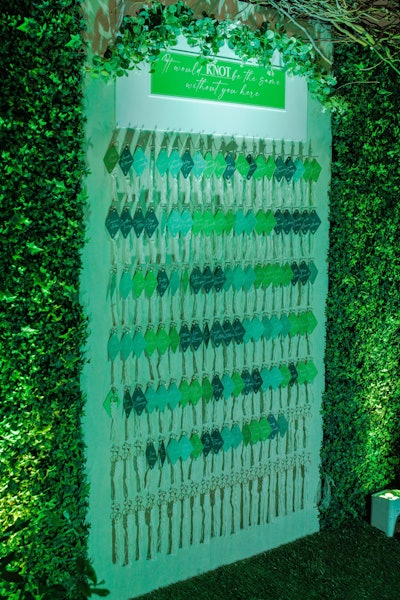 A welcome display for table cards was nestled in foliage, complete with a Celtic knot pun ('It would knot be the same without you here') and personalized motel-style keychains (in shades of green, of course) that led guests to their table numbers. Escort cards were also dressed up with macrame-style knots.