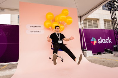 The interactive Digital HQube explored aspects of Slack, while a lounge with inflatable furniture, a bakery truck and a profile picture photo op engaged guests.