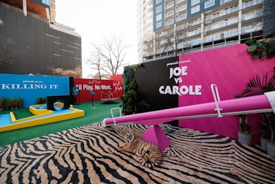 There was a pick-a-side seesaw for Joe v. Carole. Civic Entertainment Group handled production for the Peacock activation.