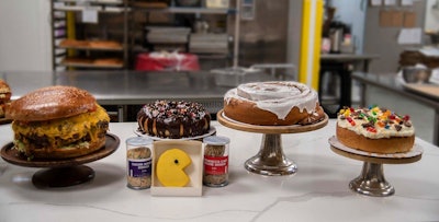 In 2019, the PAX East menu included larger-than-life versions of favorite comfort foods, including an enormous cheeseburger, a giant chocolate-glazed doughnut, a vanilla-frosted doughnut, oversize “Wookie Dough,” the Pac-Man 'Pinata' cookie, and the 'Atilla the Bun'—20-inch cinnamon bun.