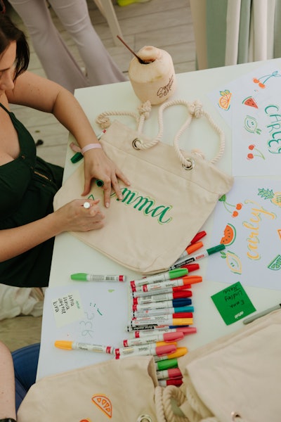 A customizable tote, sunglasses, a beach towel and Supergoop sunscreen were handed out to attendees.