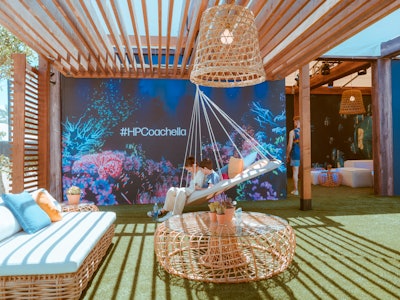 Adjacent to HP's futuristic Antarctic Dome—a 360-degree audiovisual experience housed inside a geodesic projection dome—was a serene lounge area that used rounded furniture pieces and long lines to make a design impact.