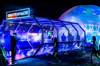 Another Neon Carnival sponsor was DIRECTV, which drew attention during the event with five unique activations. VIP guests could start their evening by visiting DIRECTV’s Neon Oasis, a jungle-themed and branded lounge, before traveling to the carnival ground through DIRECTV’s futuristic Portal (pictured). Other experiences included a branded zipper ride and an additional VIP lounge. And throughout the night, the brand’s Geodome illuminated the sky with immersive projection mapping.