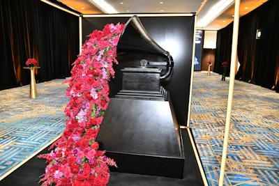 “We wanted to create bold and beautifully Black moments that would make a statement,' said MVD Inc. co-founder and creative director Massah David. 'Guests were greeted by the first-ever 6-foot black gramophone, which we designed with 300 pounds of flowers pouring out to signify the Black music collective receiving their flowers. A five-piece band was added to the show, led by world-renowned musician Adam Blackstone, as he curated the night's performances showing the expansive range of Black music.'