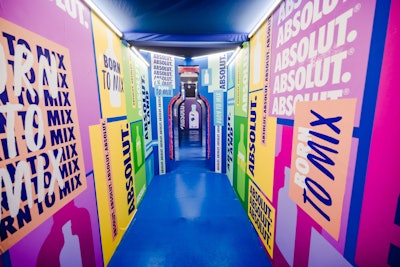 In addition to its headline-grabbing metaverse moment, Absolut hosted an in-person activation on festival grounds. Guests entered the MKG-designed space through a tunnel made from colorful Absolut branding.
