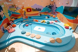 The YouTube Artist Lounge featured a fun seating area inspired by the YouTube logo—complete with bright and colorful pillows and desert-inspired wall decor.