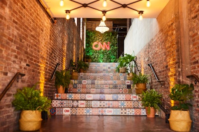 When the nearly 400 VIP attendees entered the 7,500-square-foot AutoShop for an invite-only brunch (hosted by CNN) to close out the weekend, they were greeted by printed, tiled stairs with pops of live greenery and a CNN logo, indicating to invited guests that they were definitely at the right place. The staircase “led them to the main event space, where people were greeted with an assortment of Prosecco, rose, and white wines,” said Caroline Cook, the director of creative brand marketing of events and activations for CNN Worldwide.