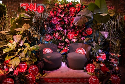 A photo-worthy seating nook leaned into the international theme, with black lounge seating, a jungle-like background, and stand-out red clocks representing times in different countries around the world. Decor was provided by locally based Social Supply, and Linder Global Events produced the hangover brunch.