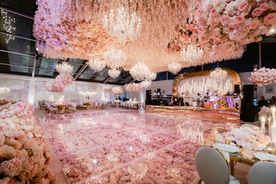 To create a floral fantasy, Sara Renee Events teamed up with experiential and design firm Cerka Creative to immerse guests in a field of 450,000 pink flowers. Complete with crystal chandeliers, rose gold-colored glassware, and a blush bar, for one night, attendees truly saw la vie en rose.