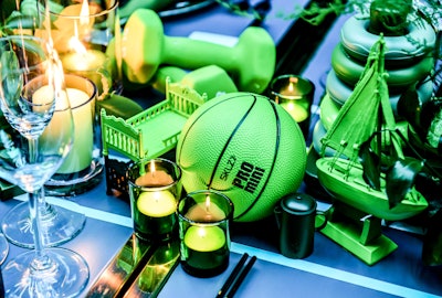 For YMCA's Chromatics Athletic Night benefitting the YMCA of Greater Toronto, a charity to give back to the community, locally based Candice&Alison Events Group created a monochromatic tablescape. Playing into the Y's countless programs promoting healthy lifestyles and keeping kids active, decor included basketballs, free weights, miniature model boats, and other children's toys—all colored green.