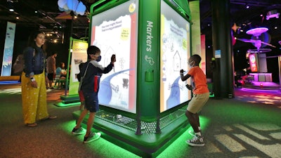 The exhibition features plenty of coloring and drawing stations.