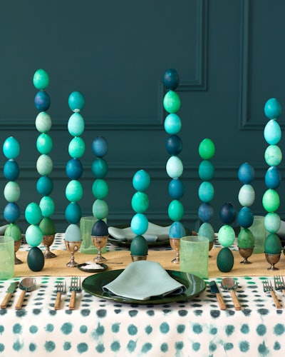 Instead of pastel bunnies and frilly wicker baskets, New York-based David Stark Design challenged himself to rethink the typical for this Easter table. Cue what he referred to as the 'impossible stack,' inspired by artist Constantin Brâncuși. The gravity-defying tablescape surprised both guests and Stark himself, with towering, green-and-blue-hued Easter eggs.