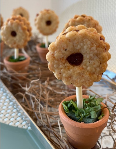 Stamford, Conn.-based Marcia Selden Catering jazzed up corporate catering with its signature savory linzer cookie and roasted tomato jam. Cut into the shape of a flower and served on a 'stem,' the treat made for a photo-worthy, one-bite hors d'oeuvres that played perfectly into the event's timing in spring.