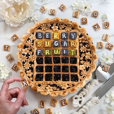 Jessica Leigh Clark-Bojin, the Vancouver-based pie artist and mastermind behind Pies Are Awesome, told BizBash that she loves to play with her food. And in a playful nod to her friends' love of the word game Wordle, Clark-Bojin created this edible masterpiece. Can you guess the word yet?