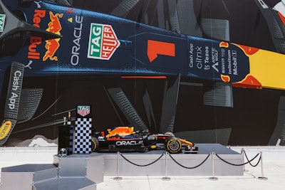 A mural depicting Max Verstappen’s Oracle Red Bull Racing car served as the circuit’s backdrop, while elevated recreations of petrol stations acted as product displays. Also on-site was a shipping container decorated with brand stories, detailing TAG Heuer’s history in motorsport and providing guests with go-kart gear to really set the Grand Prix scene.
