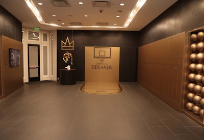 The area celebrating Bel-Air included a mini, gold-plated basketball court. Throughout the pop-up, guests could choose and customize free fashion items from the shows. Each week of the activation featured a different customization option—ranging from screen printing to embroidery to air brushing—from a different artist.