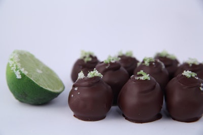 MDW isn’t all about patriotism—after all, it’s also known as the unofficial kickoff of summer (which truly begins on June 21 this year). So, to start the season off sweet, Katherine Anne Confections in Chicago has a margarita truffle available to order at $3.25 per piece, in boxes of seven or 16 for gatherings small and large, or $8 two-piece boxes to hand out as a tasty favor. Each bite tastes of tequila, lime juice, lime zest, fleur de sel, and bittersweet chocolate. The treats can be delivered within Chicago, or customers can pick up the truffles from Katherine Anne Confections’ location in Logan Square. This summer season, the cafe is also offering a banana daiquiri truffle, a piña colada truffle, a merlot pecan caramel, and a rosemary margarita caramel.