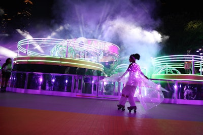 More than 600 people attended the event, which featured a 17,000-square-foot roller rink, a disco-inspired floral installation, and a live performance by a 16-person cast of skaters.