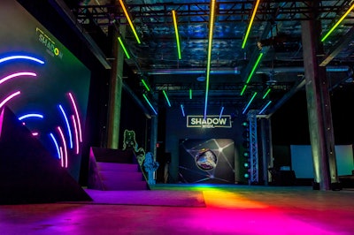 “The Shadow High experience was anchored by a massive overhead truss structure with LED strips and a bright, vivid array of LEDs projected on the ground,” Stoelt explained. “It also included three, six-foot LED rings and an array of moving spots to create shadows and ‘glitches.’”